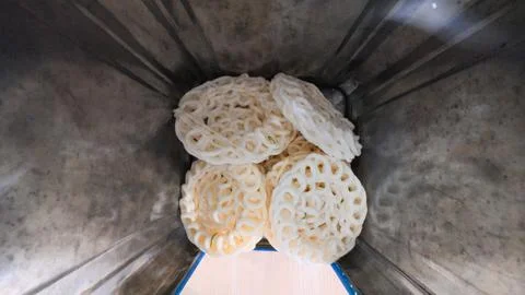 White patterned crackers inside round metal vessel Stock Photos