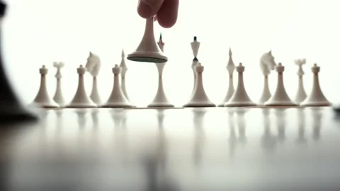 The white pawn makes the first move. Сhess game Stock Footage 143188364