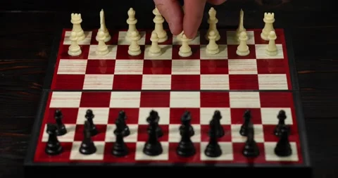 White pawn steps in front. Chess pieces on a chessboard. The game started. Bu Stock Footage 148353435