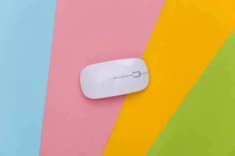 White pc mouse on colored background. Top view. Flat lay Stock Photos