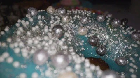 White pearls on the surface of light aqua color donut 库存影片 154191684