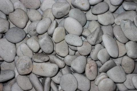 White Pebble Stone Texture Background with Smooth Round River Rocks for Zen.. Stock Photos