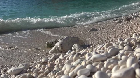 White pebbles and sea waves on Buyukcakil beach Stock Footage 332861058
