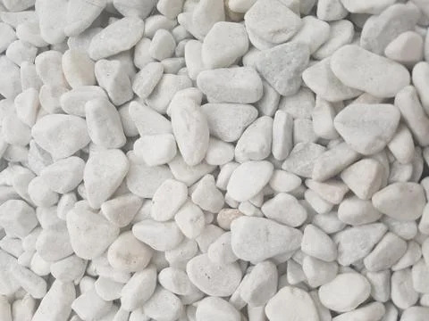 White pebbles on the floor as a background Stock Photos