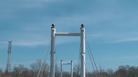 White pedestrian bridge crossing the Ural river Stock Footage 75014032
