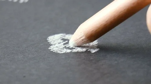White pencil draws a line Stock Footage 78910879
