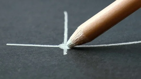 White pencil draws a line Stock Footage 79099057