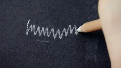 White pencil draws a line Stock Footage 79099330