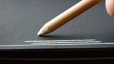 White pencil draws a line Stock Footage 79230323