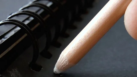 White pencil draws a line Stock Footage 79230367
