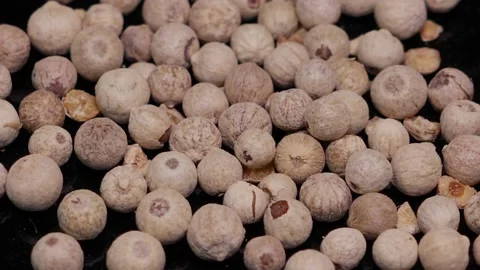 White pepper on a rotating base. Black background. Stock Footage 147151755