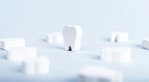 White perfect teeth on blue background. Oral hygiene, stomatology, health care Stock Photos