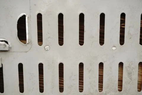 A white perforated metal surface Stock Photos
