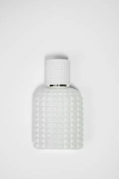 White Perfume Bottle with beautiful pattern isolated on White Background Stock Photos