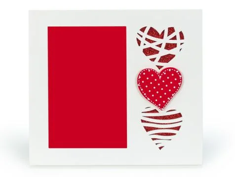 White photo frame with red hearts on isolaed  background Stock Photos