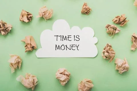 White piece of paper with the words time is money written on it Stock Photos