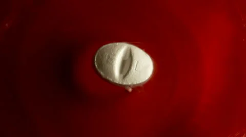 White pill in water. Red background. Time lapse Stock-Footage 35742368