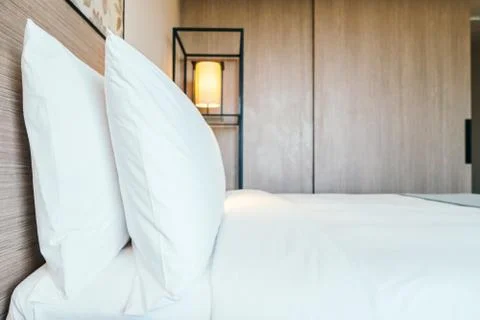 White pillow on bed Stock Photos