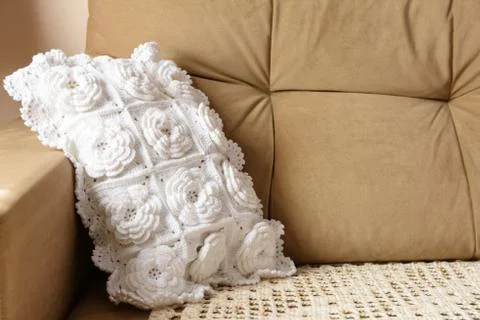 White pillow on the couch. Stock Photos