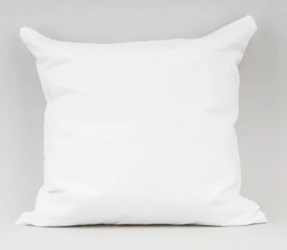 White pillow on white background Stock Photos