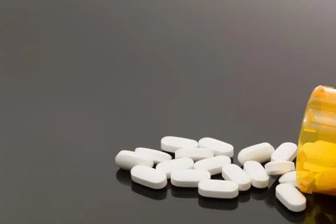 White Pills and Botttle-2 Stock Photos