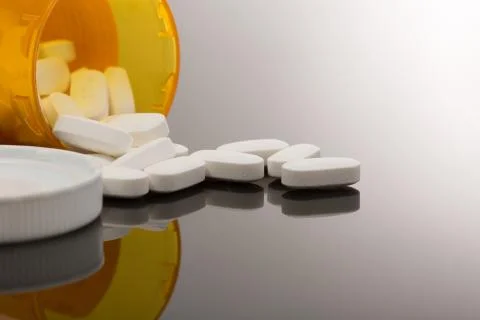 White Pills and Botttle-4 Stock Photos