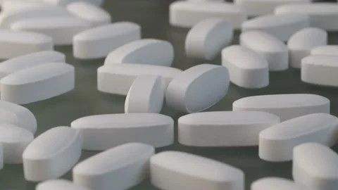White pills and brown on the table Stock Footage 140322870