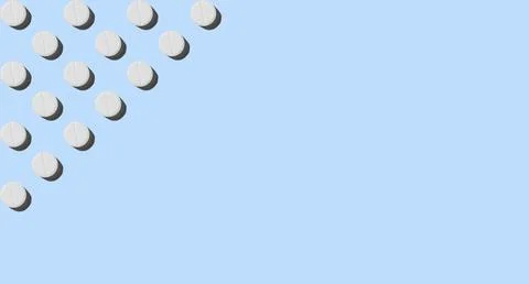 White pills on a blue background. Pattern, banner Stock Photos