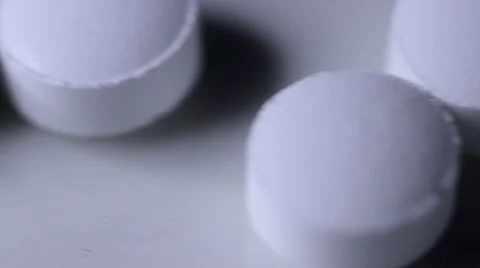 White Pills Close Up Passing By Camera Vidéo 66293794