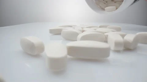 White pills in extreme close up on the white background Stock Footage 211399463