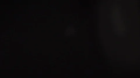 White pills fall and break.Black background Stock Footage 127620107