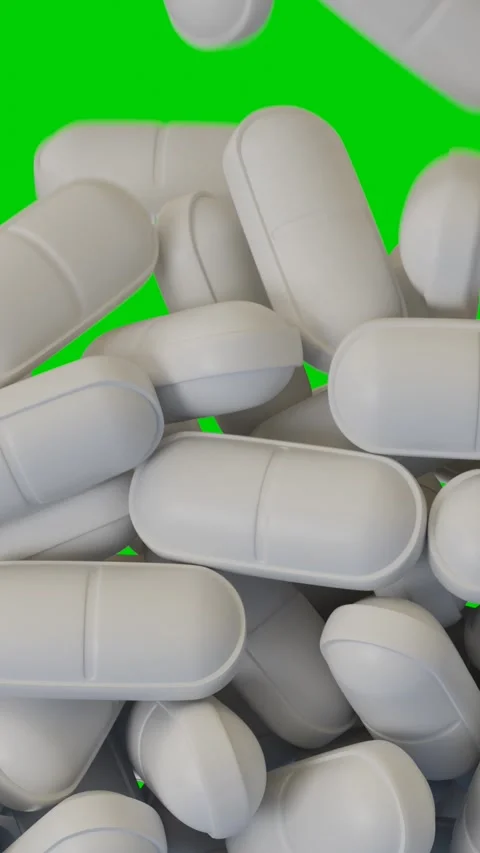White pills fall and cover the green screen Stock-Footage 266149448