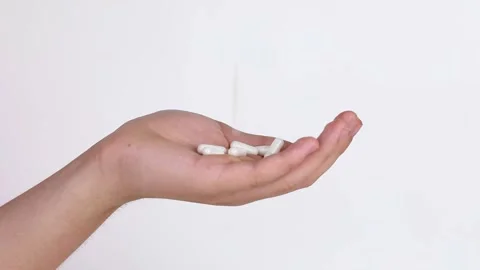 White pills fall into the hand Video stock 201129883