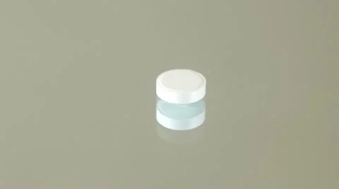 White pills falling Stock Footage 21736240
