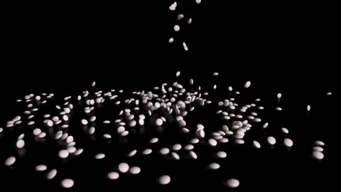 White pills falling on the ground. Stock Footage 252485001
