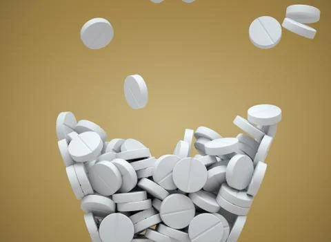 White pills falling Stock Photos
