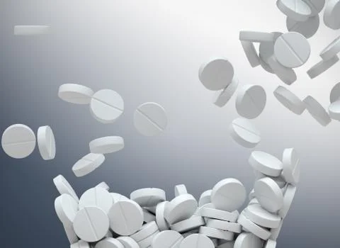 White pills falling Stock Photos