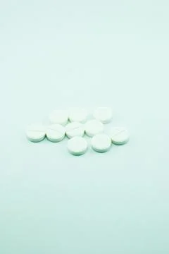 White pills isolated Stock Photos