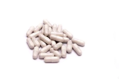 White pills isolated on white background. Stock Photos