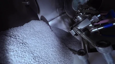 White pills mixing close up Stock Footage 76739466