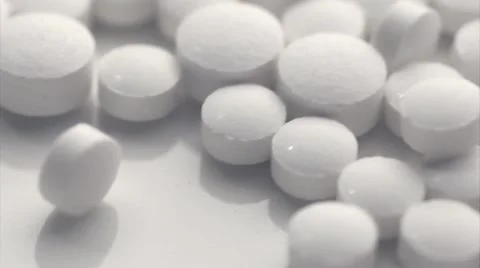 White pills moving close up medication tablets Vídeos de archivo 49730461