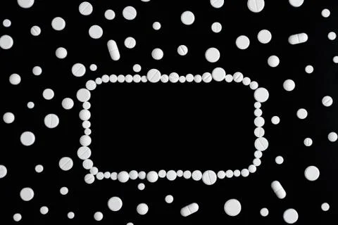 White pills or capsules on a white background Stock Photos