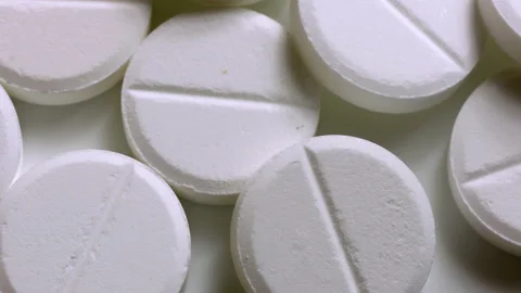 White pills or tablets rotating background Video stock 141180383