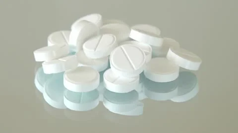 White pills rotate Stockbeeldmateriaal 21736119