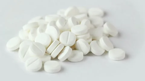 White pills rotate on white background. closeup Stock Footage 8654091