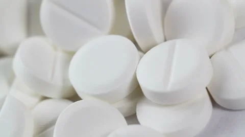 White pills rotate on white background. closeup Stock Footage 8654432