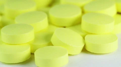 White pills rotate on white background. closeup Stock Footage 8654947