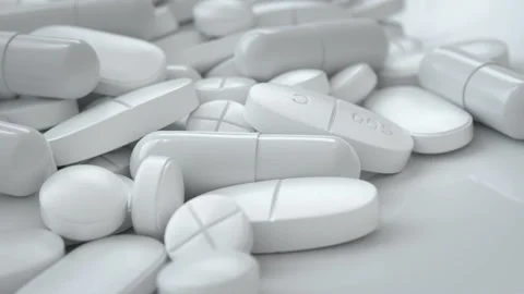 White Pills Rotating on the Table Video stock 114557802