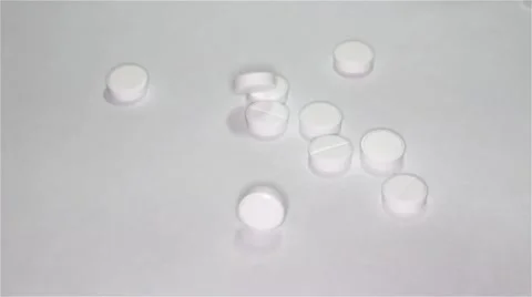 White pills scattered on the table 스톡 동영상 55821906