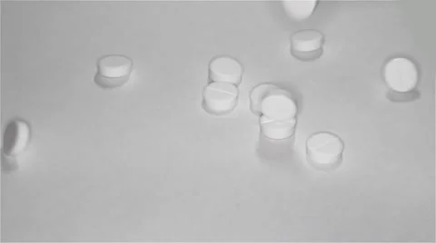 White pills scattered on the table Stock Footage 55821910